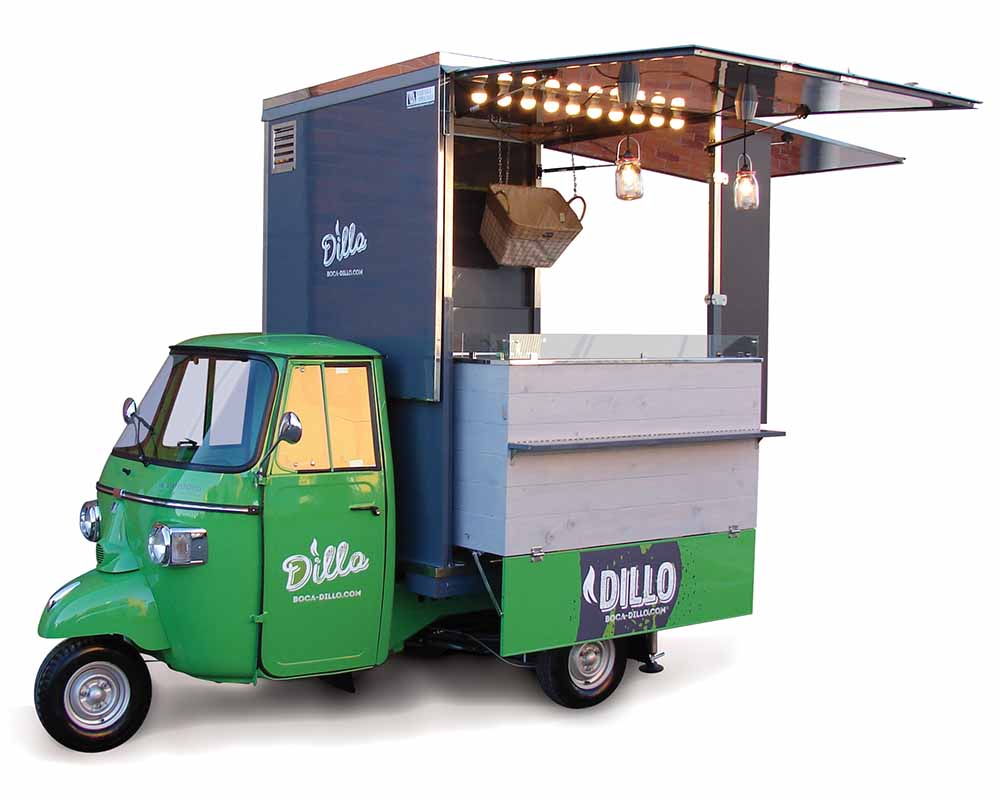 Piaggio ape van converted in food truck for vending panini for Dillo. Green colour