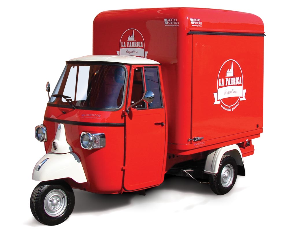 Food van Piaggio Ape La Fabrica selling empanadas in Parma. Colour red