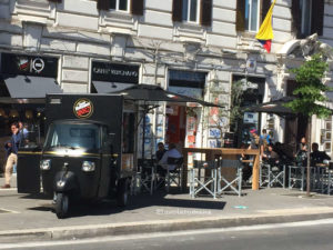 Ape TR parked in front of a cafeteria Vergnano in Flaminio square in Rome