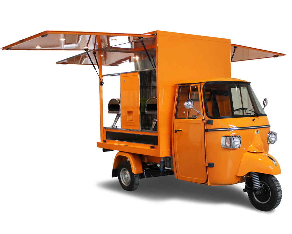 Dalla bicicletta al 3 ruote Piaggio Ape Pizza il passo è breve. Pizzavelo arancione comprato a costi economici da imprenditrice di Tolosa in Francia